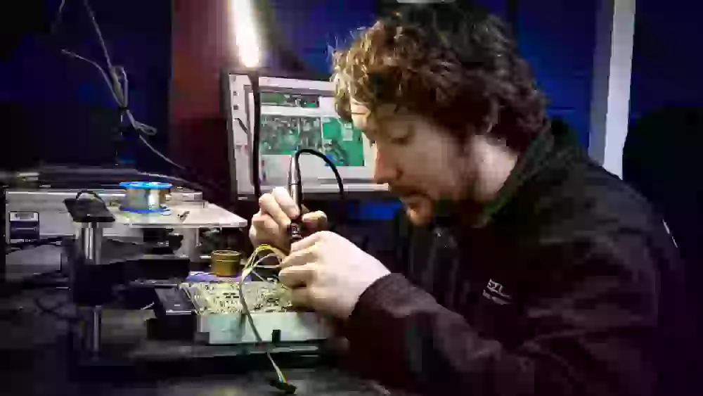 Man soldering car ECU in Birmingham