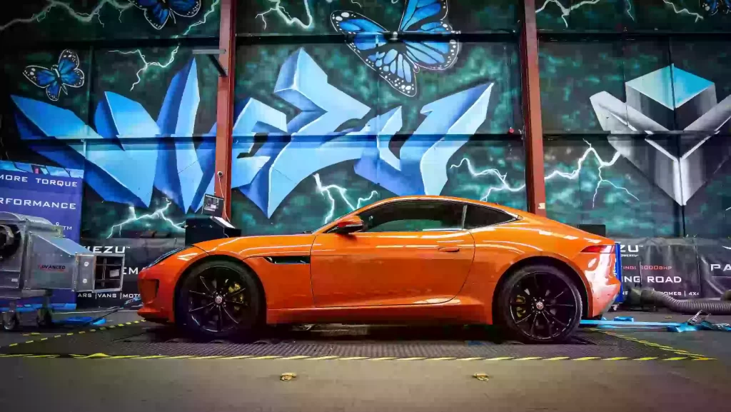 Orange Jaguar F-Type on a dyno