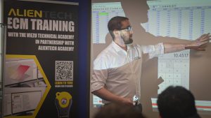 Alientech ECM Titanium Training Day at VIEZU with teacher showing the students something on the board | ECU Remapping Training