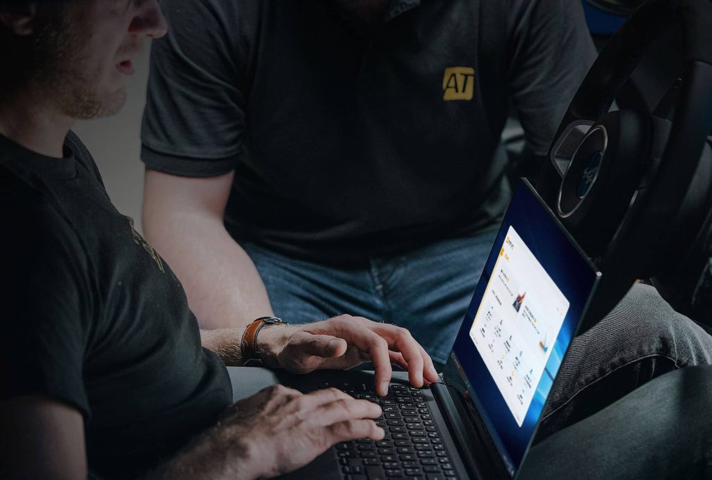 man on laptop using autotuner